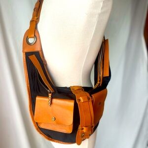 Free People multi pocket leather detail,  buckle sling bag